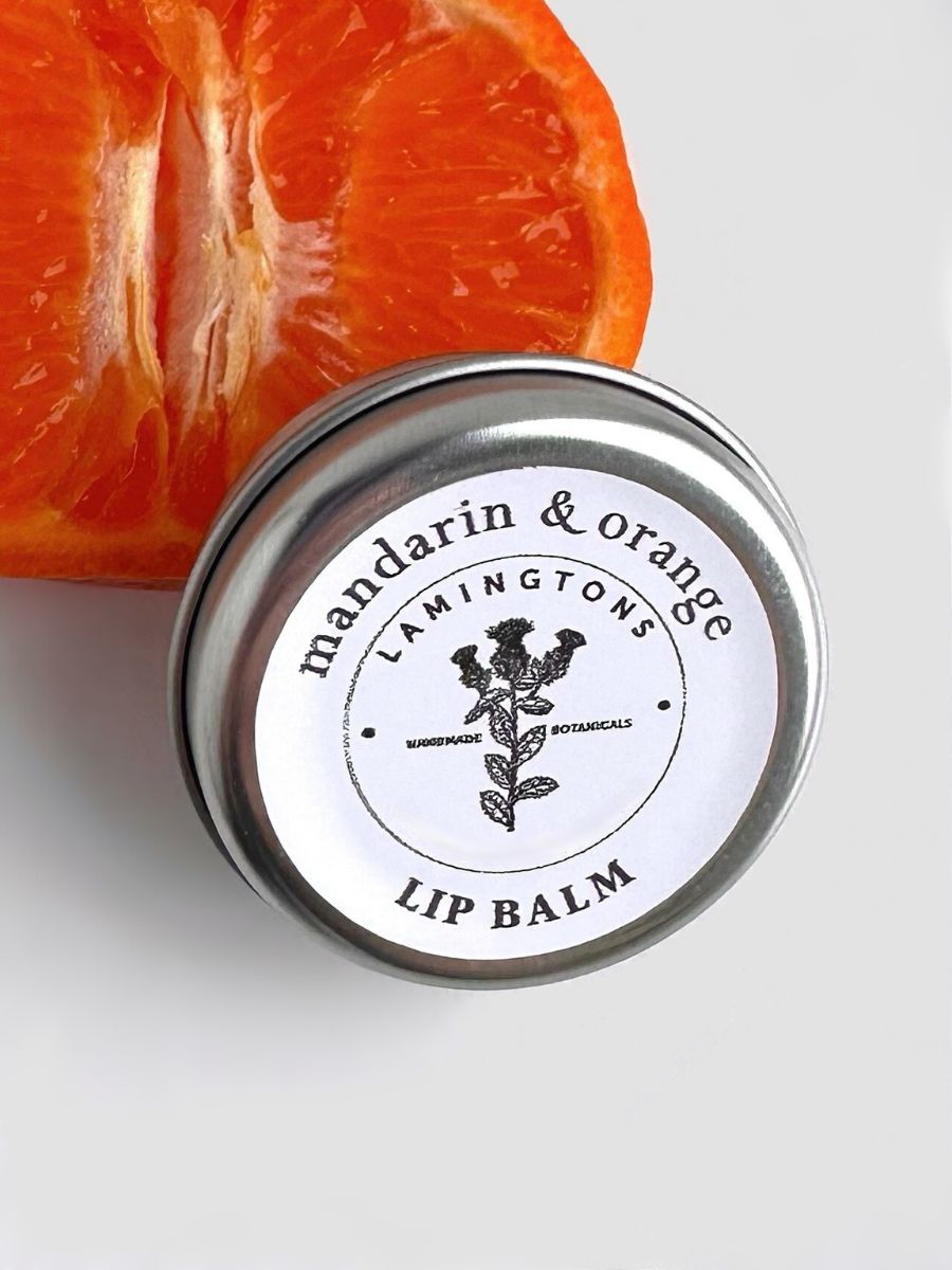 A jar of mandarin and orange lip balm.